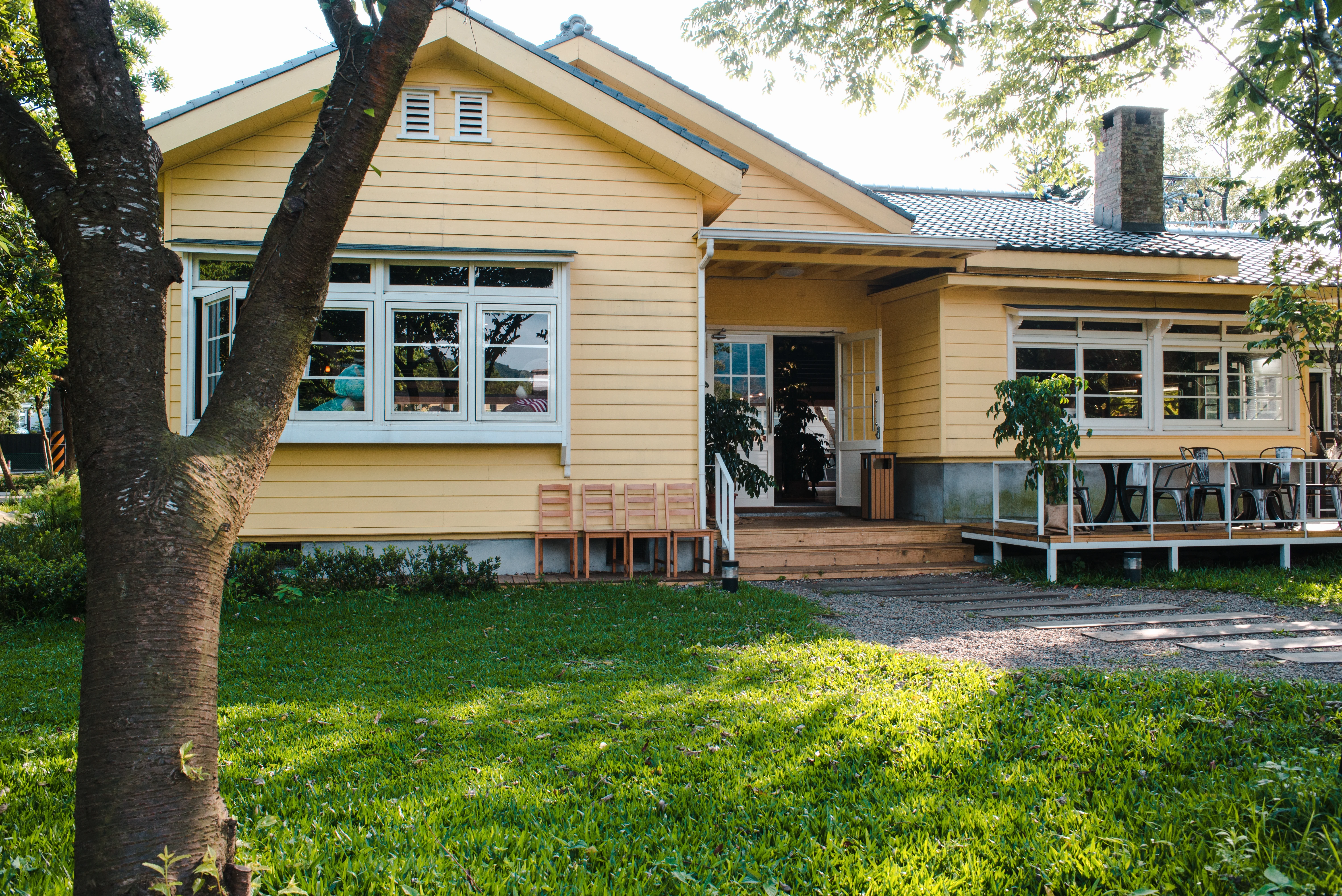 Charming Yellow House With Wooden Windows Green Grassy Garden | My Dallas ADU